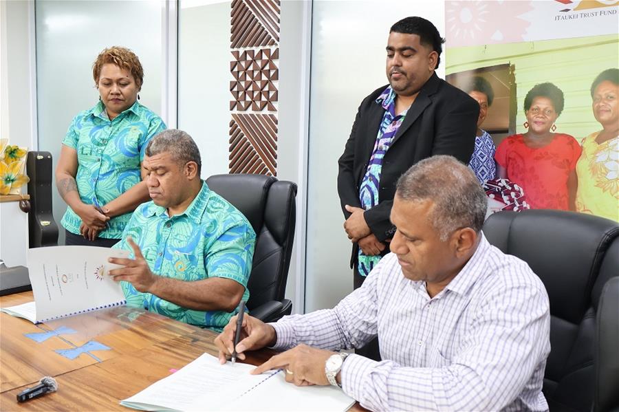 2. LTA Chief Executive Officer Irimaia Rokosawa, left, with iTaukei Trust Fund Board CEO Aisake Taito during the signing of the MOU this week