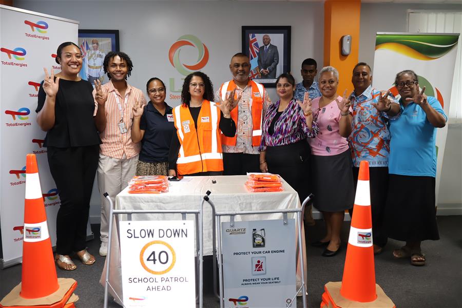 LTA and TotalEnergies staff with the school patrol items to promote road safety. Image LTA LTA and TotalEnergies staff with the school patrol items to promote road safety. Image LTA
